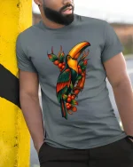 Tropical Toucan Bird Jungle Art Graphic Tshirt Colorful Nature - model wearing grey tee, leaning on column