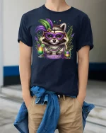 Mardi Gras Raccoon Mask Graphic T Shirt With Festive Party Spirit - model wearing navy tee with hands in pockets