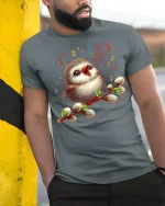 Singing Bird Music Art Graphic T Shirt With Joyful Nature Vibes - model wearing grey tee, leaning on column
