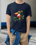 Cute Winter Toucan Art Tee Funny Holiday Animal Graphic T Shirt - model wearing navy tee with hands in pockets