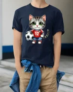 Cute Soccer Cat Cartoon Graphic Tee With Playful Sports Style - model wearing navy tee with hands in pockets