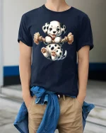 Cute Dalmatian Puppy Playing with Rope Cartoon Graphic T Shirt - model wearing navy tee with hands in pockets