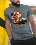 Cute Tiger Photographer Cartoon Graphic T Shirt with Creative Vibes - model wearing grey tee, leaning on column