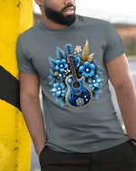 Blue Floral Guitar Art Graphic T Shirt Elegant Music Design - model wearing grey tee, leaning on column