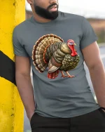 Funny Thanksgiving Turkey Graphic T Shirt Detailed Farm Art Style - model wearing grey tee, leaning on column