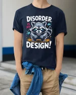 Disorder Is My Design Raccoon Graphic T Shirt Funny Quote Art - model wearing navy tee with hands in pockets