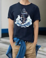 Nautical Anchor Graphic Tee With Ocean Waves And Timeless Sea Power - model wearing navy tee with hands in pockets