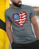 American Flag Heart Graphic Tee With Patriotic Love Style - model wearing grey tee, leaning on column