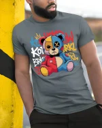 Graffiti Patchwork Teddy Bear Art Tee Urban Street Style - model wearing grey tee, leaning on column