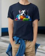 Cute Puppy With Colorful Yarn Graphic Tee Cozy Fun Art Style - model wearing navy tee with hands in pockets