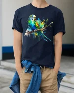 Colorful Parrot Splash Art Graphic T Shirt Vibrant Bird Tee - model wearing navy tee with hands in pockets
