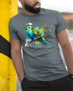 Colorful Parrot Splash Art Graphic T Shirt Vibrant Bird Tee - model wearing grey tee, leaning on column