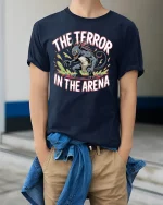 The Terror In The Arena Monster Graphic T Shirt Fierce Battle Tee - model wearing navy tee with hands in pockets