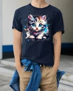 Cute Blue Eyed Kitten Graphic T Shirt Art - model wearing navy tee with hands in pockets