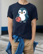 Cute Penguin Basketball Cartoon Graphic T-Shirt - model wearing navy tee with hands in pockets