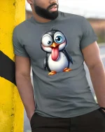 Funny Goofy Penguin Cartoon Graphic T-Shirt - model wearing grey tee, leaning on column