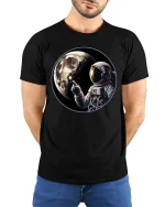 Astronaut Moon Space Graphic T-Shirt Cosmic Explorer Tee - model wearing black tee with hands behind back