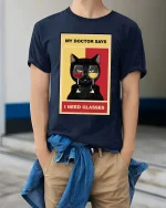 Funny Cat Wine Glasses Pun Graphic T-Shirt - model wearing navy tee with hands in pockets