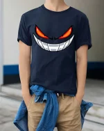 Evil Smile Red Eyes Monster Face Graphic T-Shirt - model wearing navy tee with hands in pockets