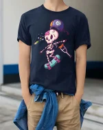 Funny Injured Skeleton Skateboard Cartoon Graphic T-Shirt - model wearing navy tee with hands in pockets