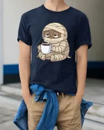 Funny Tired Mummy Coffee T-Shirt Cute Halloween Monster - model wearing navy tee with hands in pockets
