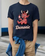 Cute Demonic Devil Cartoon T-Shirt Funny Halloween Tee - model wearing navy tee with hands in pockets