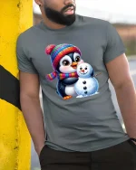 Cute Penguin Snowman T-Shirt Winter Holiday Cartoon Tee - model wearing grey tee, leaning on column