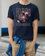 Hippo Dropamus Funny Hippo Riding Bike Cartoon T-Shirt - model wearing navy tee with hands in pockets