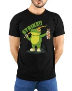 Strike Frog Fishing Funny Fisherman Cartoon T-Shirt - model wearing black tee with hands behind back