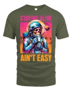 Staying Alive Ain’t Easy Funny Astronaut Skull T-Shirt - military green t-shirt on white background