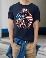 Patriotic Skeleton Uncle Sam 4th of July Graphic T-Shirt - model wearing navy tee with hands in pockets