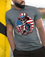 Patriotic Skeleton Uncle Sam 4th of July Graphic T-Shirt - model wearing grey tee, leaning on column