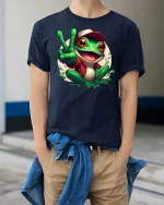 Peace Frog Cartoon T-Shirt Funny Cute Amphibian Graphic Tee - model wearing navy tee with hands in pockets
