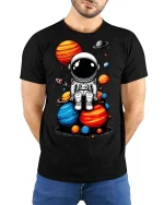 Cute Astronaut Sitting on Planets T-Shirt Space Graphic Tee - model wearing black tee with hands behind back