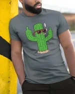 Cool Smoking Cactus T-Shirt Funny Desert Cartoon Graphic Tee - model wearing grey tee, leaning on column