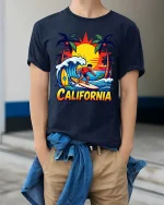 California Surfing T-Shirt Sunset Beach Surfer Graphic Tee - model wearing navy tee with hands in pockets