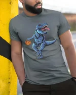 Basketball T Rex Dinosaur T-Shirt Funny Sports Animal Tee - model wearing grey tee, leaning on column