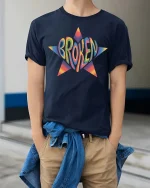 Broken Star Graphic T-Shirt Colorful Retro Streetwear - model wearing navy tee with hands in pockets