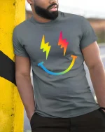 Rainbow Lightning Smile T-Shirt Colorful Happy Graphic Tee - model wearing grey tee, leaning on column