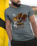 Cowboy Skull With Cigar T Shirt Wild West Graphic Tee - model wearing grey tee, leaning on column