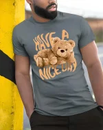 Have A Nice Day Bear Graphic T-Shirt Cute Cozy Vibe Tee - model wearing grey tee, leaning on column