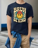 Bruh Be Kind Smile Face Retro Graphic T-Shirt Vintage Tee - model wearing navy tee with hands in pockets