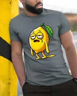 Funny Tired Lemon Cartoon Graphic T-Shirt Lazy Mood Tee - model wearing grey tee, leaning on column