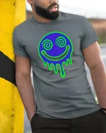 Neon Drip Smile T-Shirt Psychedelic Face Graphic Tee - model wearing grey tee, leaning on column