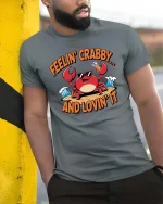 Feelin Crabby T-Shirt Funny Beach Crab Summer Graphic Tee - model wearing grey tee, leaning on column