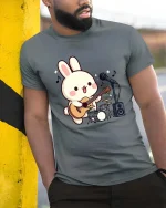 Cute Bunny Guitar T-Shirt Kawaii Music Cartoon Graphic Tee - model wearing grey tee, leaning on column