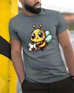 Cute Soccer Bee T-Shirt Kawaii Cartoon Sports Graphic Tee - model wearing grey tee, leaning on column