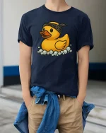 Cool Rubber Duck Graphic T-Shirt Funny Bath Cartoon Tee - model wearing navy tee with hands in pockets