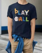Play Ball Baseball Graphic T-Shirt Funny Sports Fan Tee - model wearing navy tee with hands in pockets