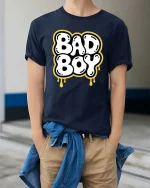 Bad Boy Graphic T-Shirt Bold Streetwear Drip Style Tee - model wearing navy tee with hands in pockets